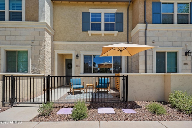 2628 S Voyager Dr Unit 104, Gilbert, AZ 85295 - doorway to property with stucco siding and a gate