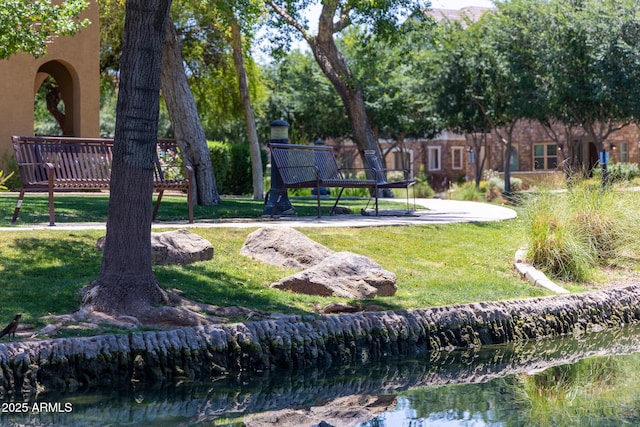2628 S Voyager Dr Unit 104, Gilbert, AZ 85295 - view of community with a lawn