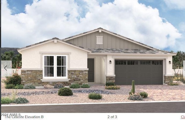 view of front of home with stone siding, decorative driveway, and an attached garage