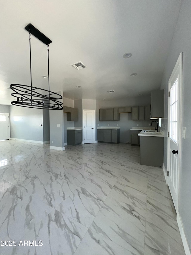 3767 N 363rd Ave, Tonopah, AZ 85354 - unfurnished living room featuring baseboards and light marble finish floors