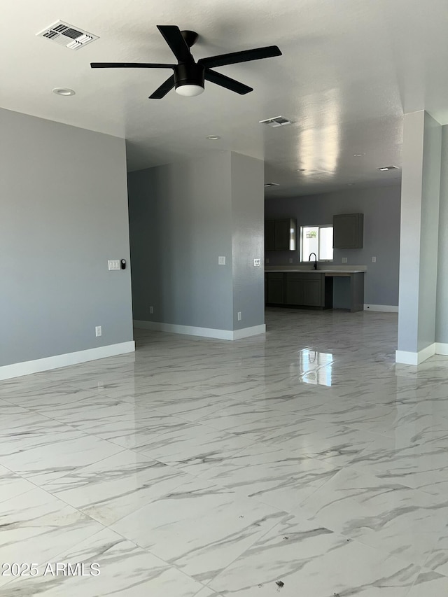 3767 N 363rd Ave, Tonopah, AZ 85354 - unfurnished living room featuring ceiling fan, light marble finish flooring, and recessed lighting