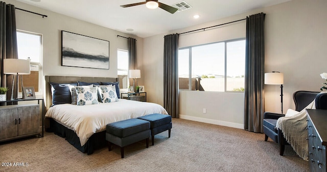 carpeted bedroom featuring ceiling fan