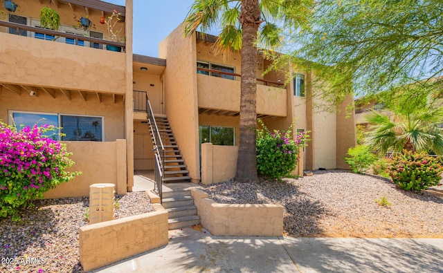 view of property featuring stairway