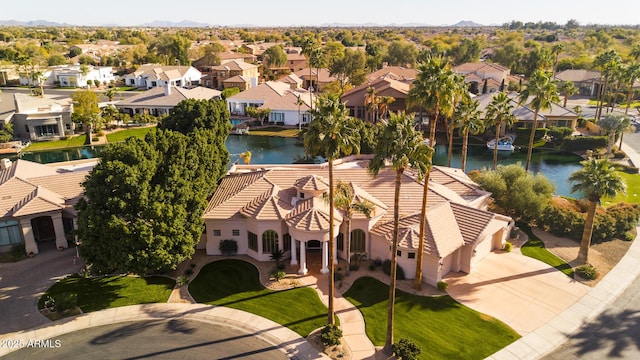 aerial view featuring a residential view and a water view