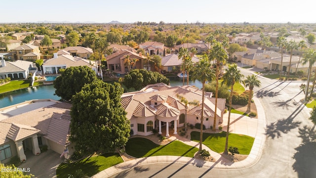 birds eye view of property featuring a residential view and a water view