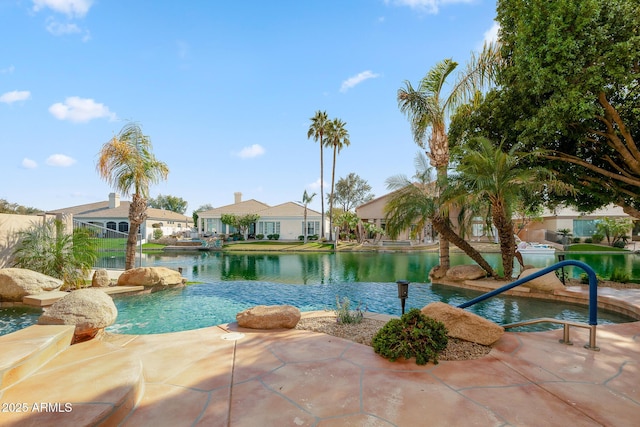 view of pool with a residential view and a water view