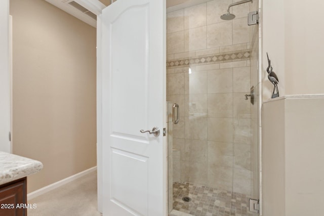 full bathroom featuring a stall shower, visible vents, and vanity