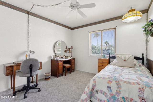 carpeted bedroom featuring crown molding and ceiling fan