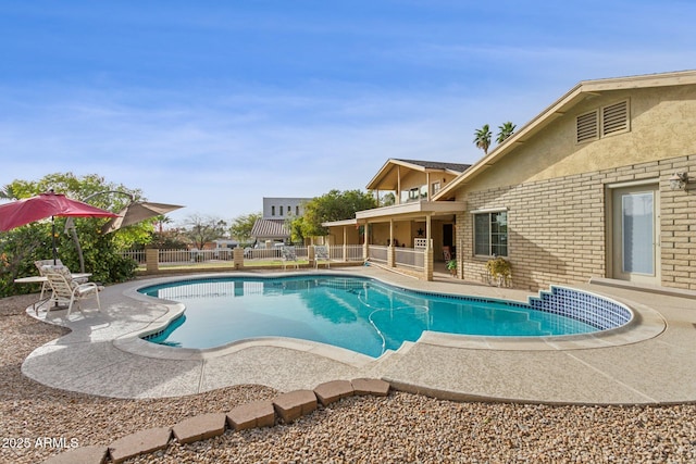 view of pool with a fenced in pool, a patio, and fence