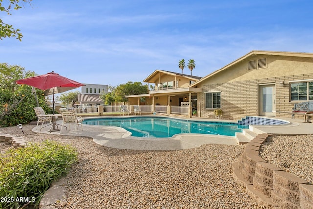 view of pool featuring a patio area, fence, and a fenced in pool