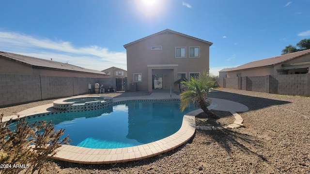 view of pool with an in ground hot tub and a patio