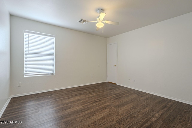 unfurnished room featuring ceiling fan and dark hardwood / wood-style floors