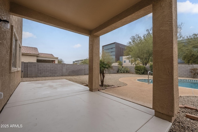 view of patio featuring a fenced in pool