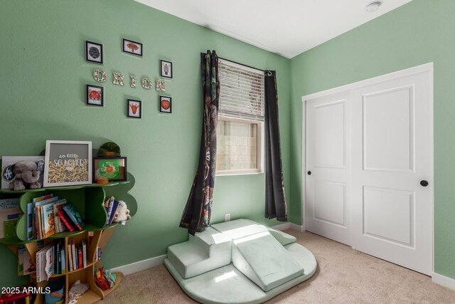 carpeted bedroom with baseboards