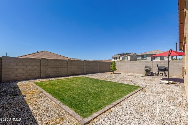 view of yard featuring a fenced backyard and a patio