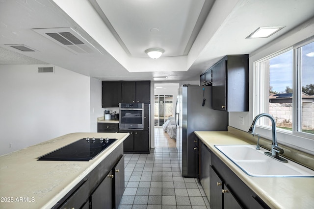 3222 W Hearn Rd, Phoenix, AZ 85053 - kitchen with light countertops, visible vents, appliances with stainless steel finishes, and a sink