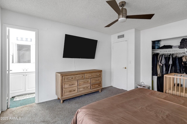3222 W Hearn Rd, Phoenix, AZ 85053 - bedroom with ensuite bath, visible vents, carpet floors, and a textured ceiling