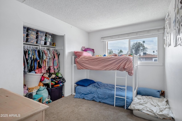 3222 W Hearn Rd, Phoenix, AZ 85053 - bedroom with carpet flooring, a closet, and a textured ceiling