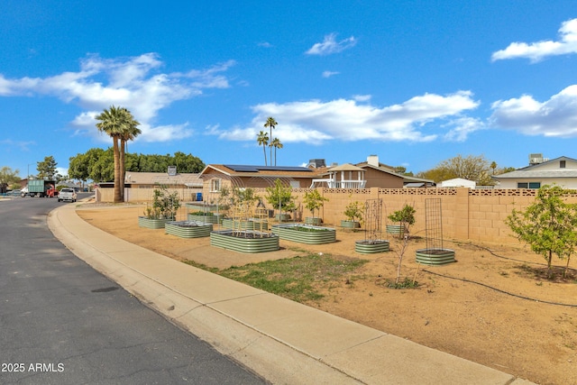 3222 W Hearn Rd, Phoenix, AZ 85053 - exterior space featuring a garden, solar panels, and fence