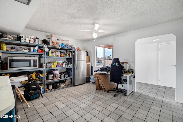 3222 W Hearn Rd, Phoenix, AZ 85053 - home office featuring a textured ceiling, light tile patterned flooring, and a ceiling fan