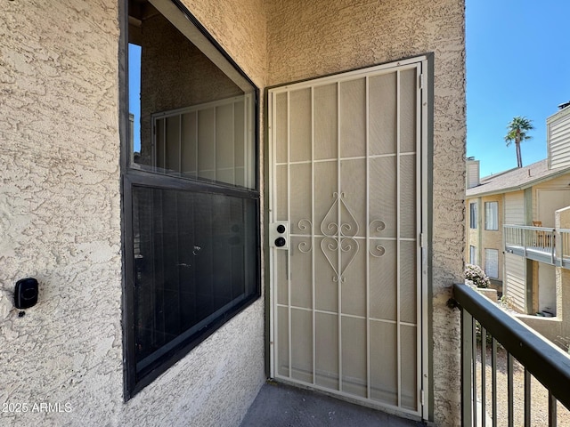 5236 W Peoria Ave Unit 232, Glendale, AZ 85302 - doorway to property featuring stucco siding and a balcony