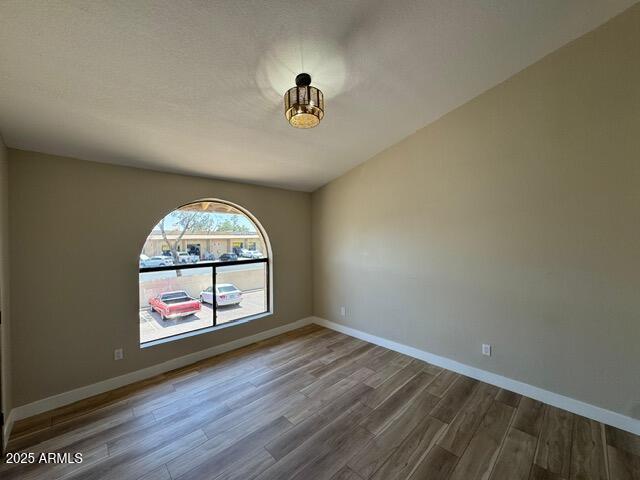 5236 W Peoria Ave Unit 232, Glendale, AZ 85302 - empty room featuring wood finished floors and baseboards