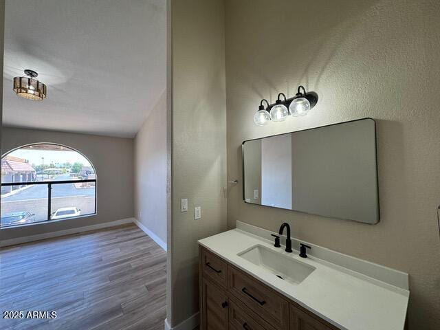5236 W Peoria Ave Unit 232, Glendale, AZ 85302 - bathroom featuring wood finished floors and vanity