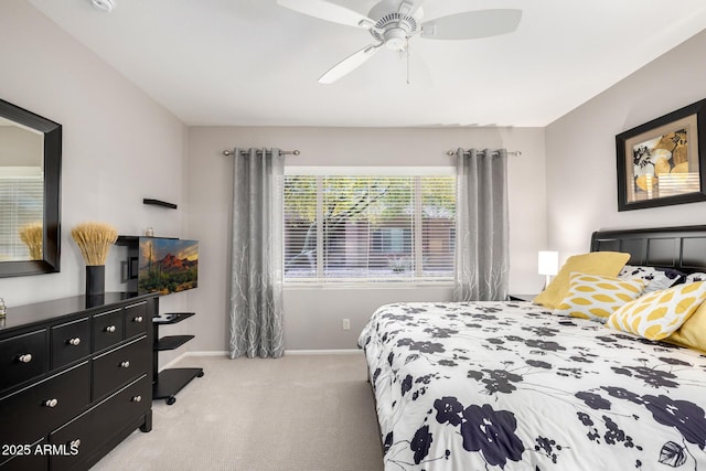 bedroom featuring baseboards, ceiling fan, and carpet flooring