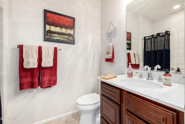 full bathroom with vanity, tile patterned flooring, and toilet