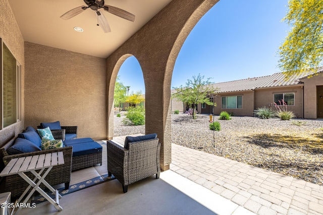 view of patio / terrace featuring ceiling fan