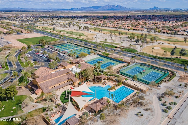 birds eye view of property with a mountain view