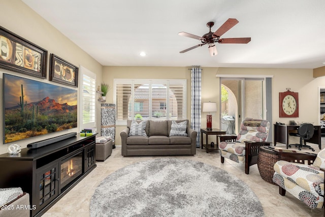 living room with a ceiling fan and recessed lighting