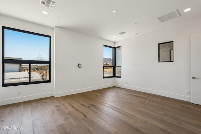 13278 E Buckskin Trl, Scottsdale, AZ 85255 - spare room featuring wood-type flooring, baseboards, and recessed lighting