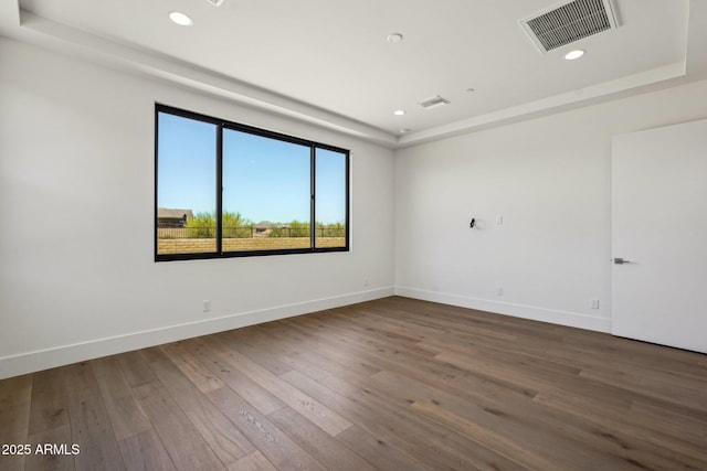 13278 E Buckskin Trl, Scottsdale, AZ 85255 - spare room with recessed lighting, hardwood / wood-style flooring, baseboards, and a raised ceiling