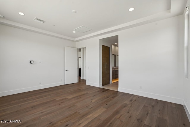 13278 E Buckskin Trl, Scottsdale, AZ 85255 - unfurnished room featuring dark wood finished floors, baseboards, recessed lighting, and a tray ceiling