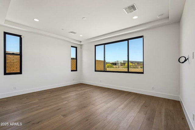 13278 E Buckskin Trl, Scottsdale, AZ 85255 - unfurnished room featuring hardwood / wood-style flooring, recessed lighting, a tray ceiling, and baseboards