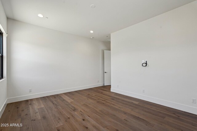 13278 E Buckskin Trl, Scottsdale, AZ 85255 - spare room featuring wood finished floors, baseboards, and recessed lighting