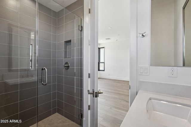 13278 E Buckskin Trl, Scottsdale, AZ 85255 - bathroom featuring wood finished floors, a shower stall, and vanity