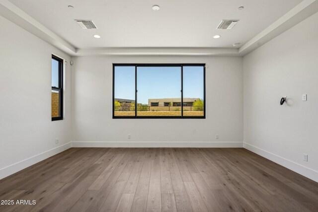 13278 E Buckskin Trl, Scottsdale, AZ 85255 - unfurnished room featuring baseboards, wood-type flooring, and recessed lighting