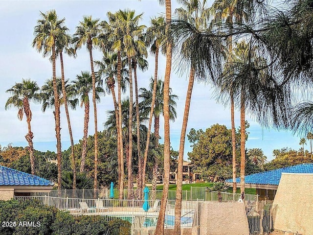 property view of water featuring fence