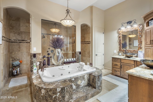 18036 W San Miguel Ave, Litchfield Park, AZ 85340 - bathroom featuring vanity, a whirlpool tub, and tile patterned floors