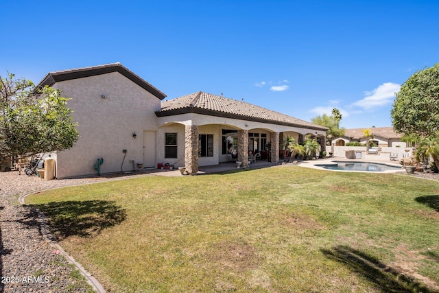 18036 W San Miguel Ave, Litchfield Park, AZ 85340 - rear view of house with stucco siding, a patio area, and a tiled roof