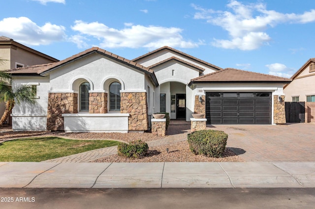 mediterranean / spanish house featuring a garage