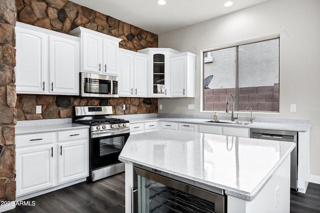 1612 E Zion Way, Chandler, AZ 85249 - kitchen with appliances with stainless steel finishes, white cabinets, sink, and beverage cooler