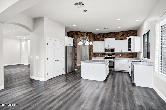 1612 E Zion Way, Chandler, AZ 85249 - kitchen featuring white cabinetry, stainless steel appliances, decorative light fixtures, a kitchen island, and sink