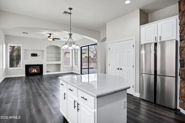 1612 E Zion Way, Chandler, AZ 85249 - kitchen featuring a center island, plenty of natural light, decorative light fixtures, white cabinets, and stainless steel refrigerator