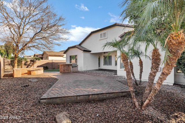 1612 E Zion Way, Chandler, AZ 85249 - rear view of property with a patio area and exterior kitchen