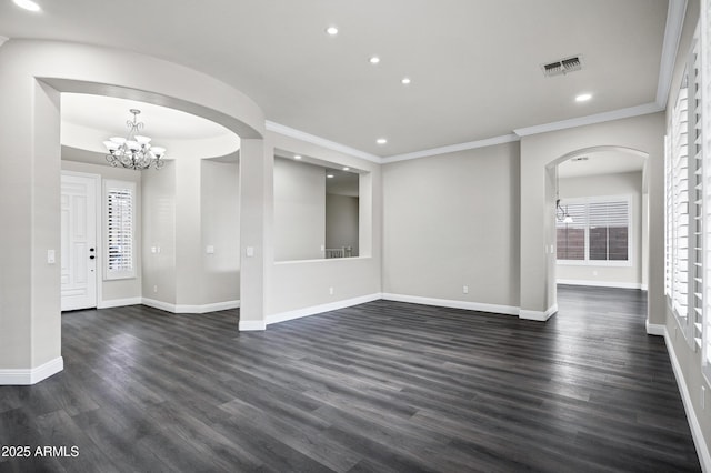 1612 E Zion Way, Chandler, AZ 85249 - empty room with a notable chandelier, dark wood-type flooring, and ornamental molding
