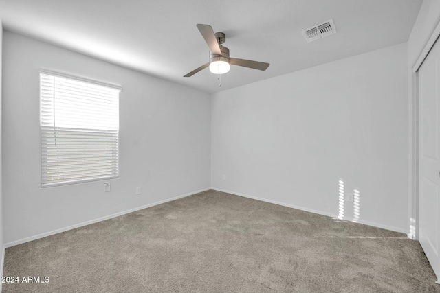 carpeted empty room with ceiling fan