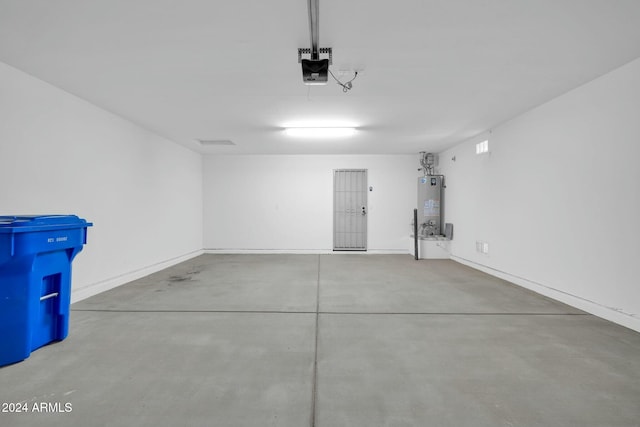 garage featuring a garage door opener and gas water heater